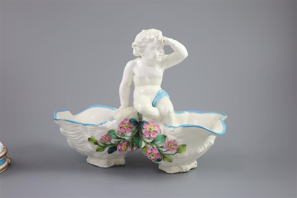 A large late 19th century French porcelain figure of Cupid, an English bone china cherub vase and a similar sweetmeat dish, tallest 3